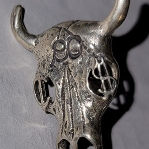 Sterling .925 tie tac, cow skull w/ Euro and $ eyes